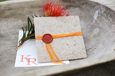 Wedding invitations with seal in burned orange colour