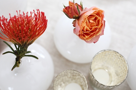 Table top decoration with Protea in burned orange